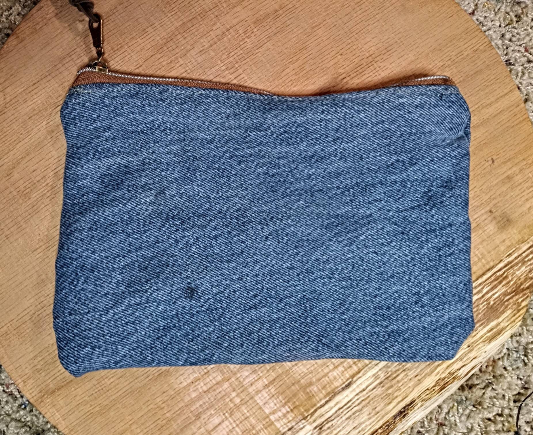Denim and leather tassle, chew can ring zip pouch.