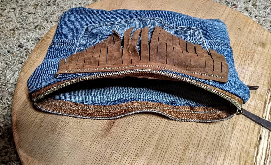 Denim and leather tassle, chew can ring zip pouch.